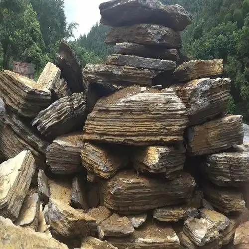 龟纹石批发商千层石驳岸制作学校景观石题字造景假山石满意石业批发